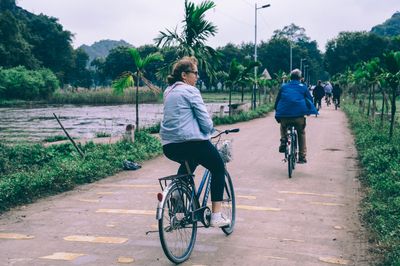 Group of people cycling at Thai Vy Temple