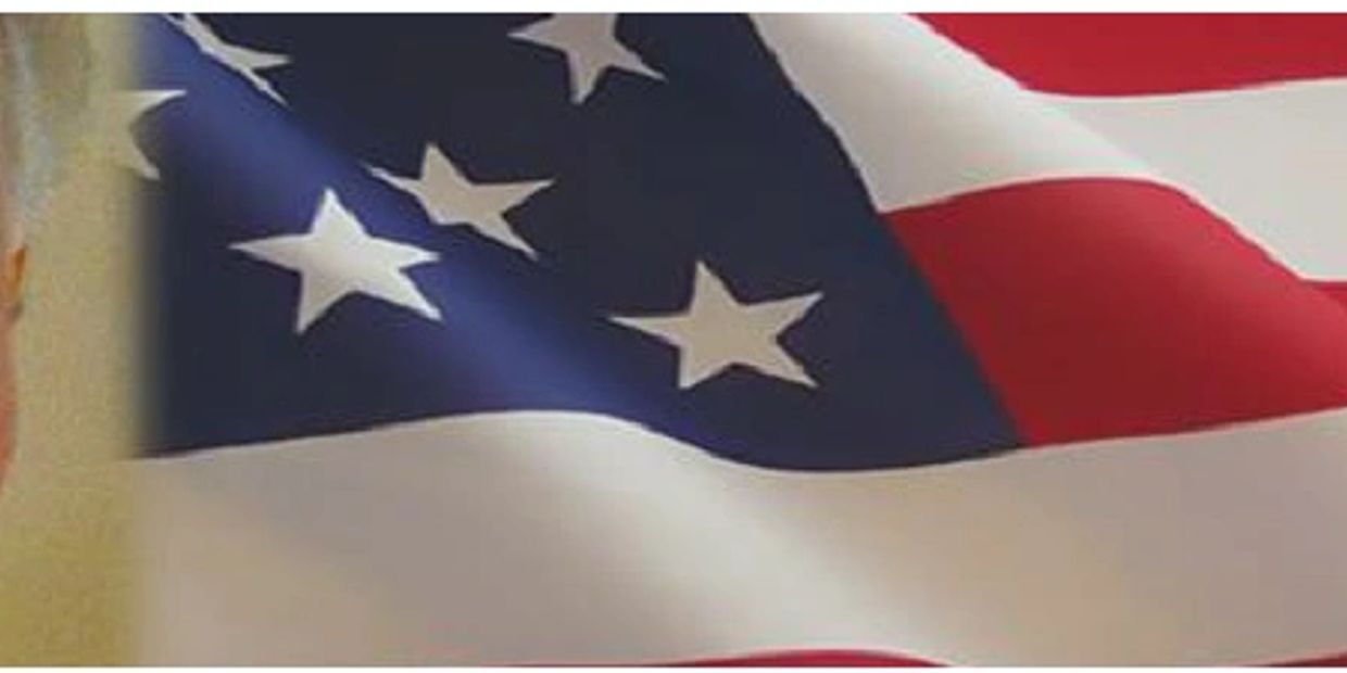 Close-up of the American flag with stars and stripes.