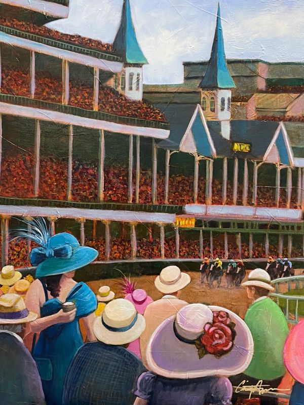 Colorful crowd watching a horse race at a large stadium with twin spires.
