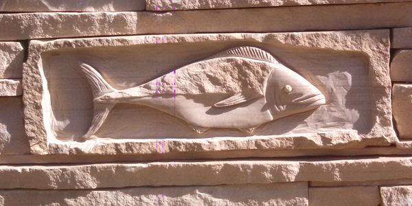 Custom carved tuna in an Arizona stone wall