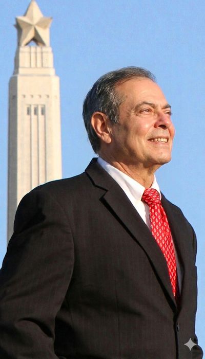 Man in suit with red tie standing confidently before a monument with a star.