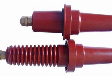 Two red high-voltage insulators with metal connectors.