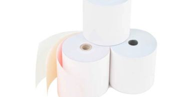 Three rolls of thermal paper for printers, one partially unrolled.