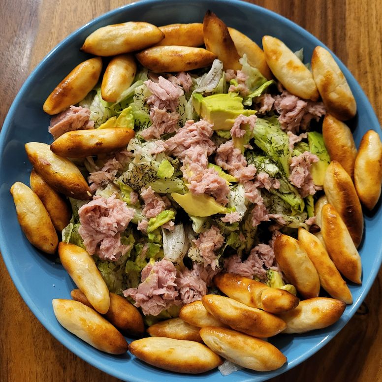 High-protein bowl meal with macros notebook and pen