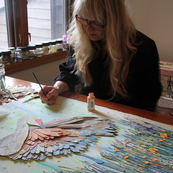 Image of Montana collage artist Shirley Robinett creating a paper sandhill crane