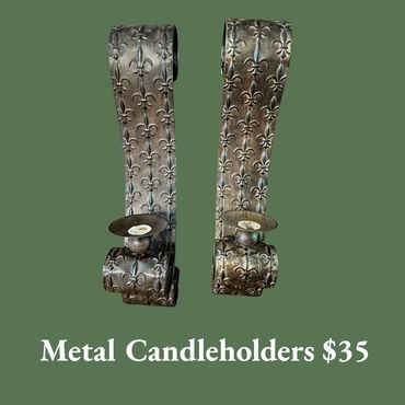 Pair of decorative metal candleholders with fleur-de-lis design, priced at $35.