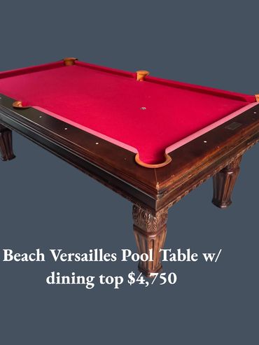Elegant Beach Versailles pool table with red felt and carved wooden legs.