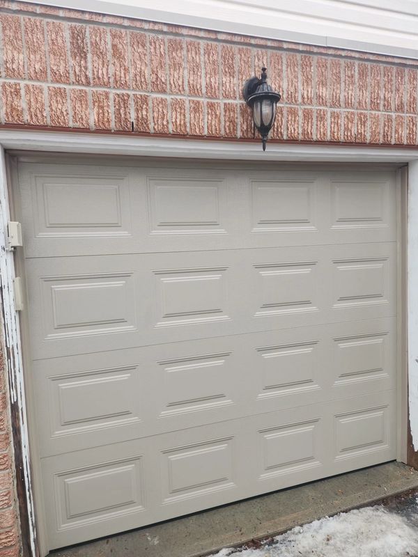 Garage door replacement in Nepean from an old non-insulated to a new insulated garage door in Nepean