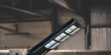 Solar LED light mounted on a shipping container corner casting