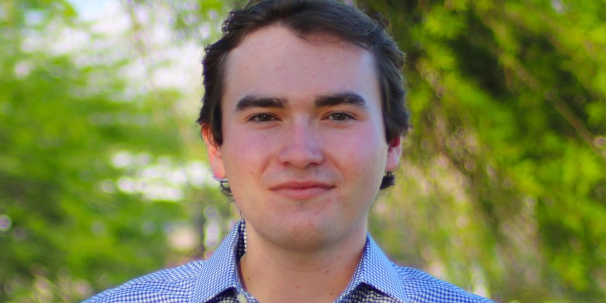 Headshot of William Howell. He is smiling.