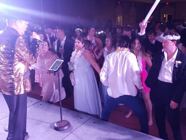 Louisiana Spice singer Quinn Rainwater works the crowd at a wedding