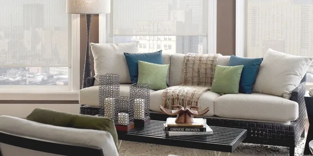 Modern living room with comfortable sofa and decorative cushions.