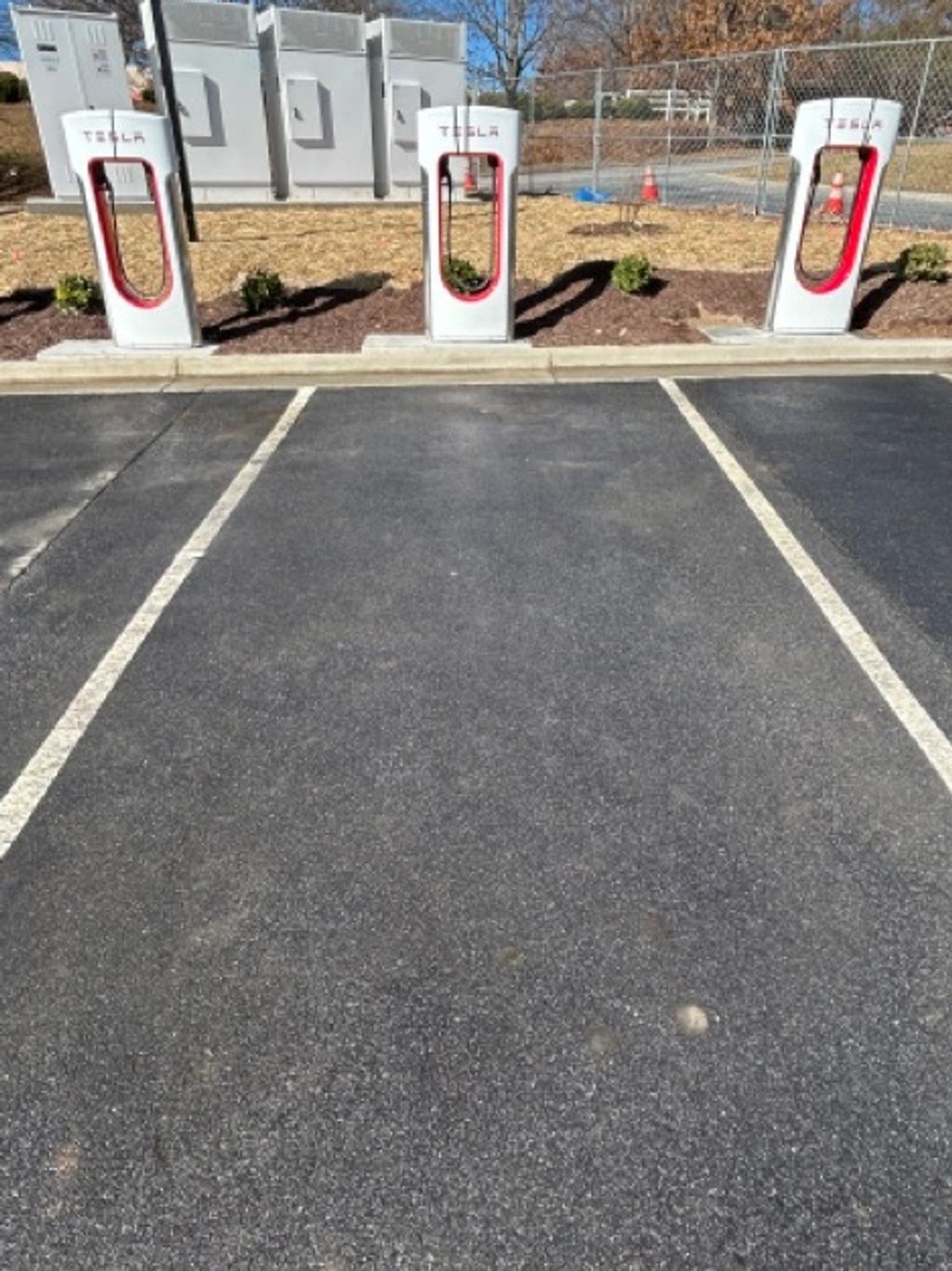 Parking space in front of a TESLA car charging station.