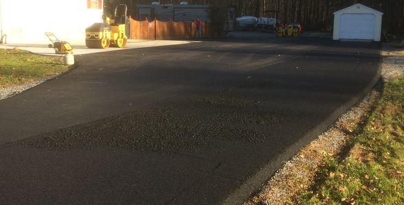 Paving a driveway with asphalt 