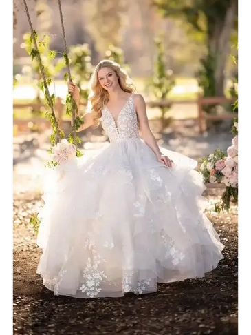 MARTINA LIANA 1105 BRIDAL GOWN BRIDE SITTING ON SWING POSING FOR BRIDAL PORTAIT