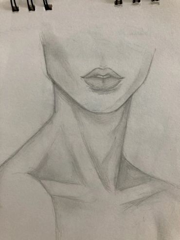Pencil sketch of a neck and lips on paper.