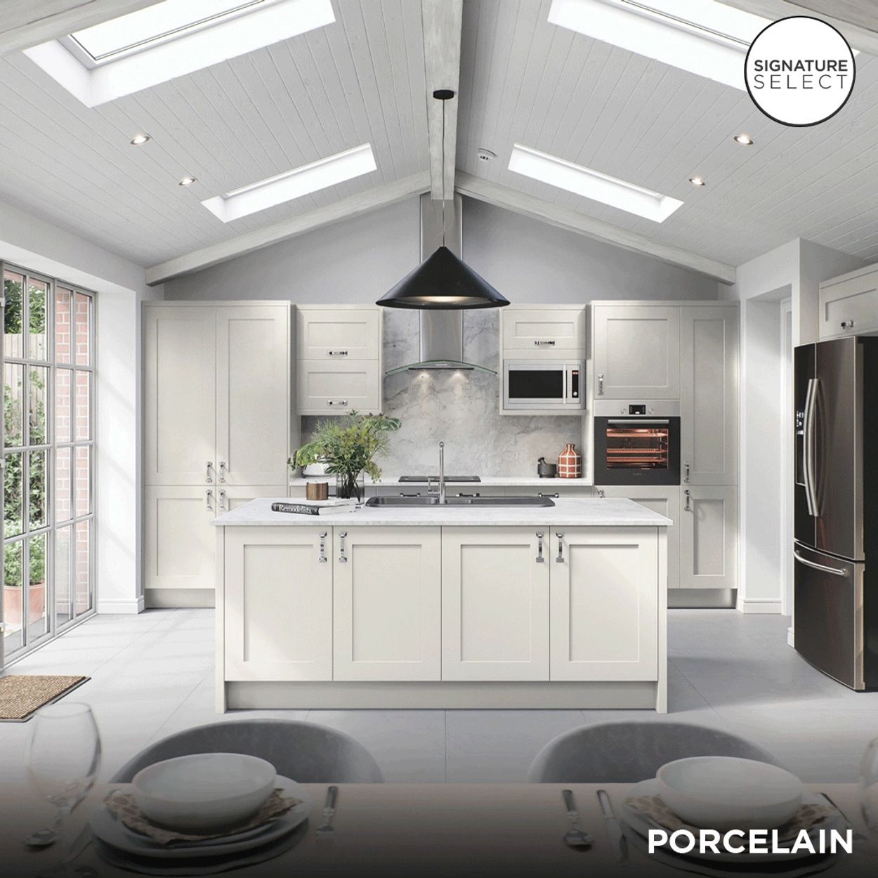 Bright modern kitchen with white cabinetry and skylights.