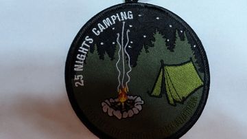 Camping patch showing a fire, tent, and night sky.
