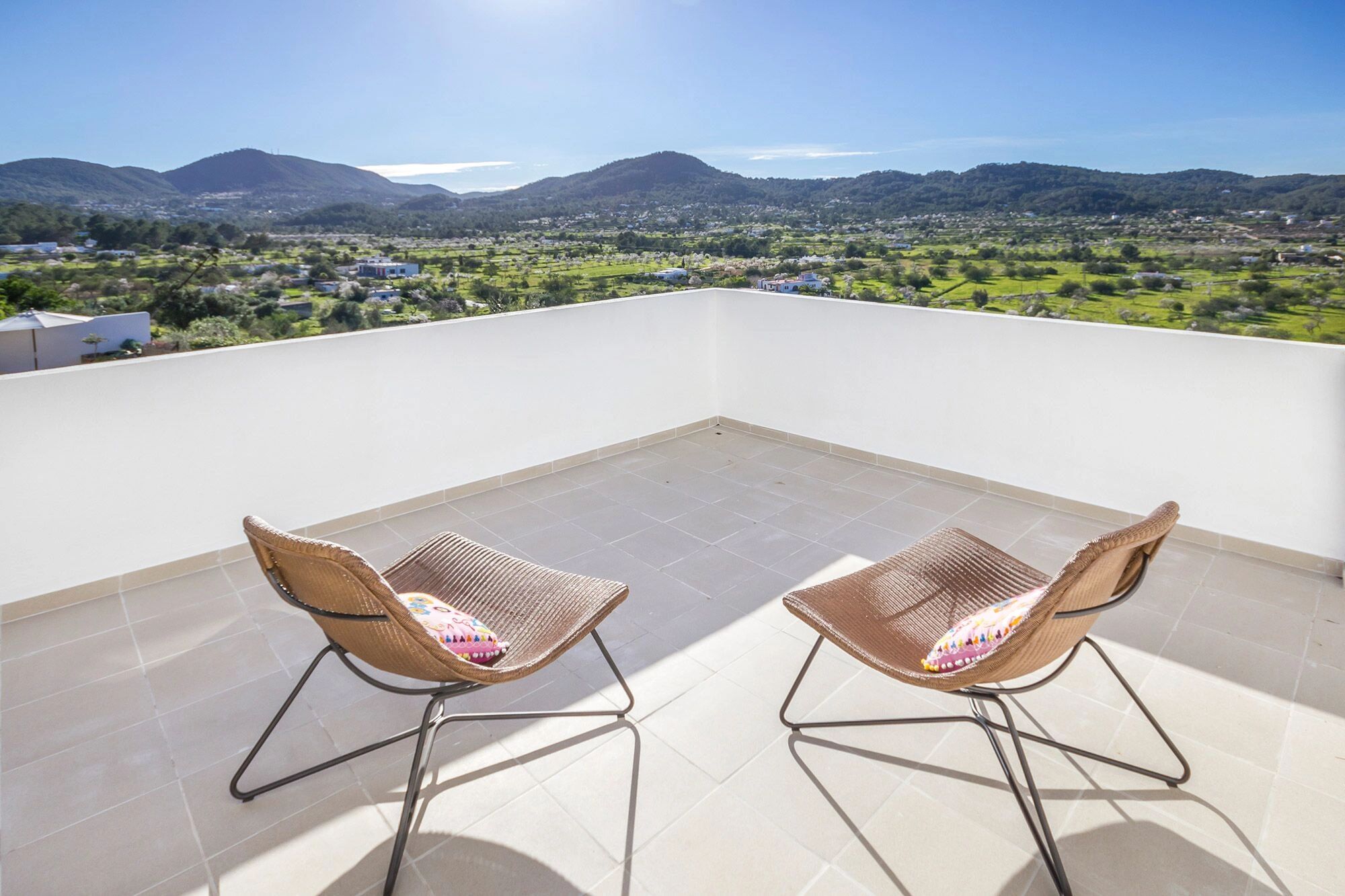 chairs and a beautiful view of the Ibiza countryside