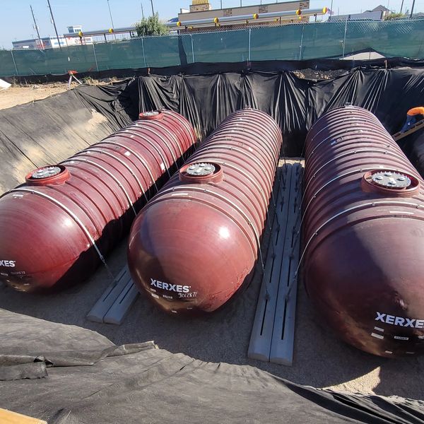 Installing 3 Xerxes Double wall 20k Fiberglass Tanks strap to dead men.