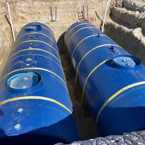 Steel Double Wall 20k UST set and strapped down for backfill.