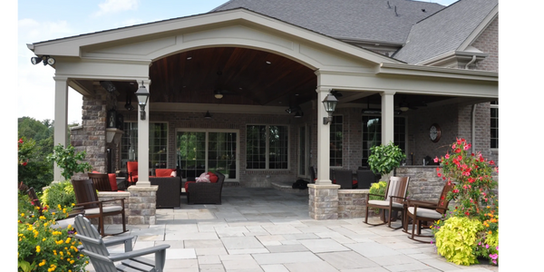 Paving stone patio with natural stone and landscape features design and build outdoor living area.