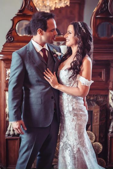 A groom and bride share a loving moment during their wedding.