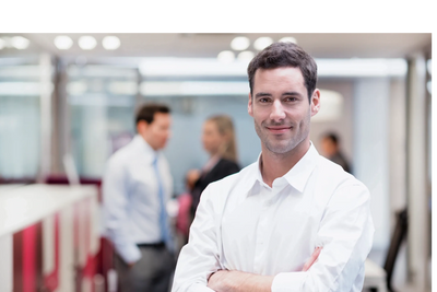Businessman stands smiling because his Nashville bookkeeping services are well handled.