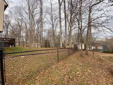Black Chain-link fence in a yard