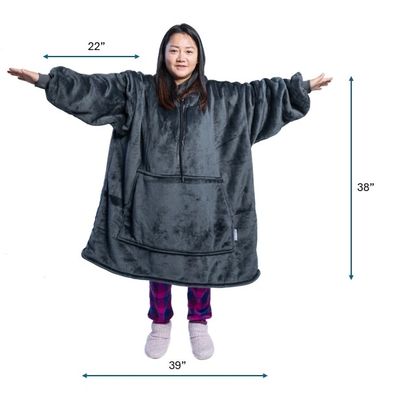 Person wearing an oversized black wearable blanket with dimensions.
