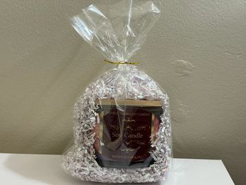 Soy candle gift wrapped in clear plastic.