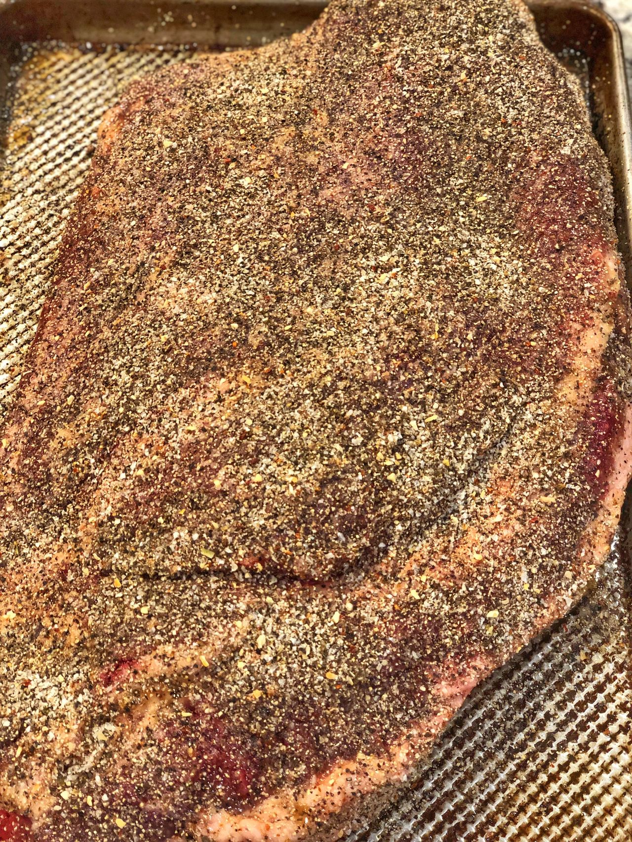 Beef brisket seasoned with salt and pepper