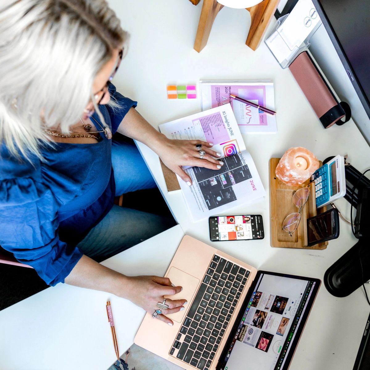 Planning corporate travel at a desk with laptop and notes