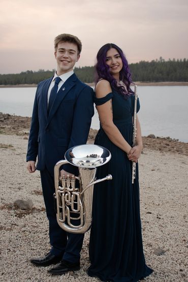 Musicians in front of a lake