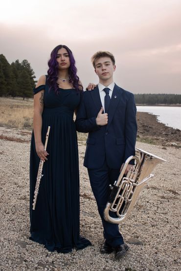 Musicians in front of a lake