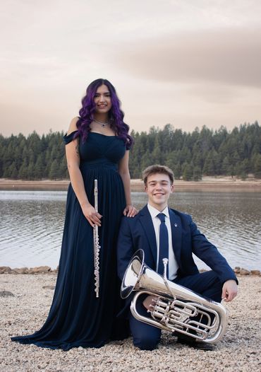 Musicians in front of a lake