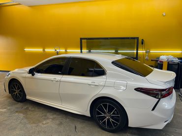 2024 Toyota Camry after we installed XPEL window tint on it at our shop in Fort Pierce