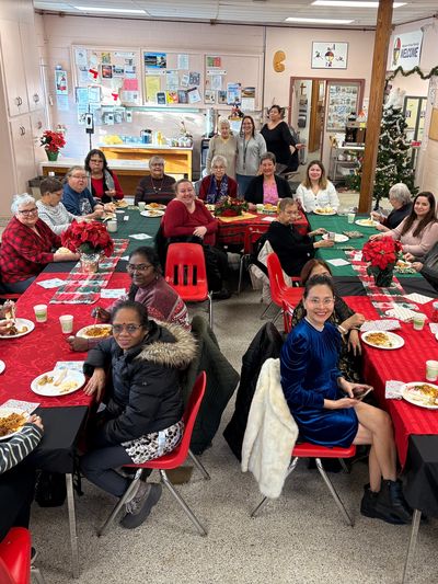 A diverse group enjoying a festive holiday meal together indoors.