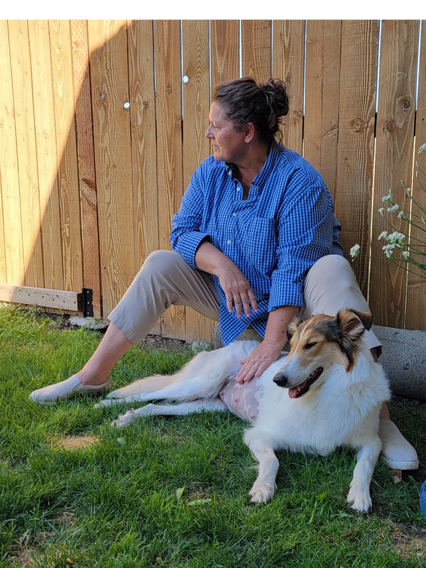 Sitting with pregnant dog.