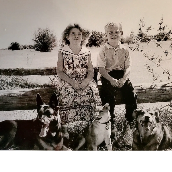 Black and white children with dogs.