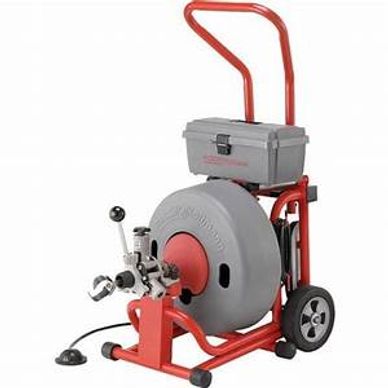 A professional red and gray drain cleaning machine with wheels and a handle.