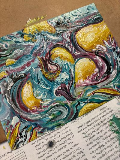 Abstract textured painting with swirls of yellow, blue, and purple on a cardboard surface.