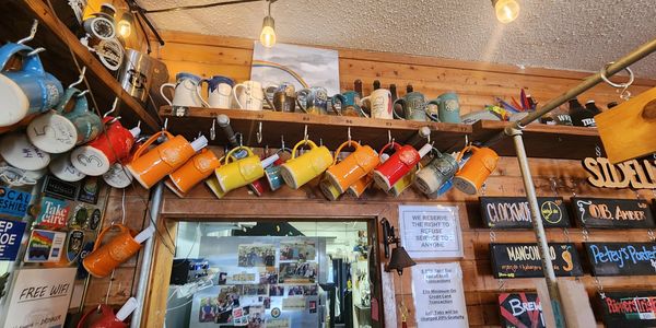 mug club mugs hung on wall