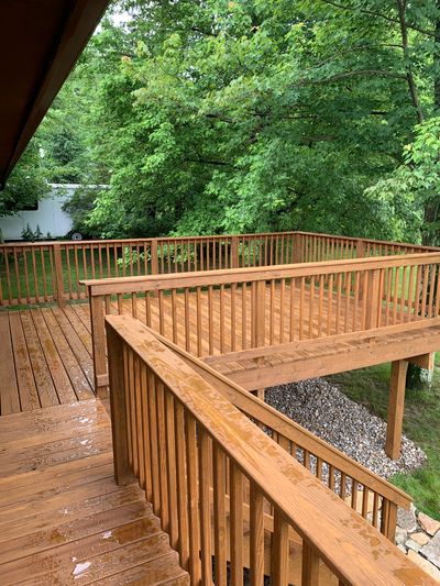 New pressure treated deck cleaning and stained with TWP Gold Stain