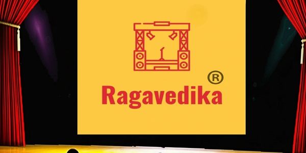 Stage with red curtains and a yellow screen showing Ragavedika logo.