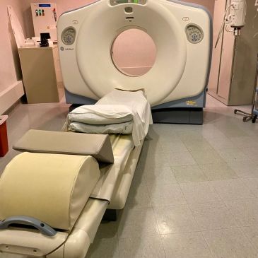 A CT scanner machine in a medical imaging room.