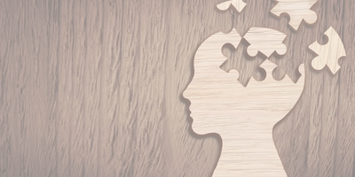 Picture of a brain as a puzzle with pieces being put together. 