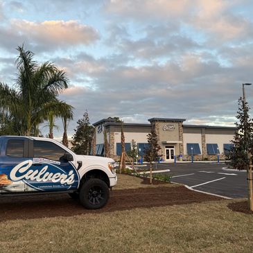 A Culver's branded truck parked near a Culver's restaurant.