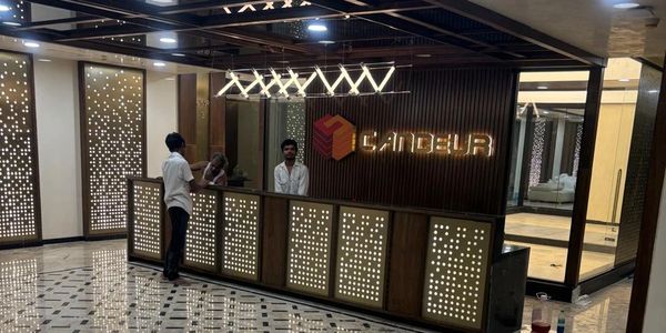 Reception area with illuminated decor and staff.