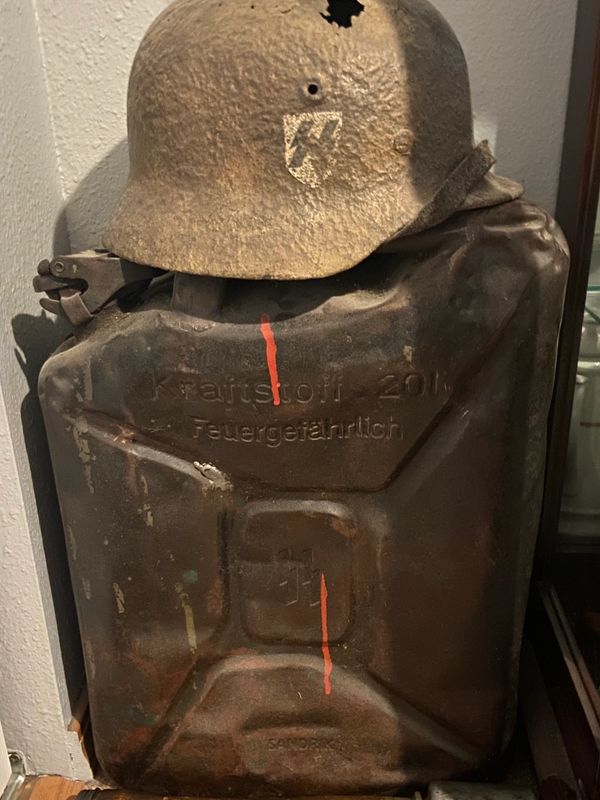 german helmet and gas can